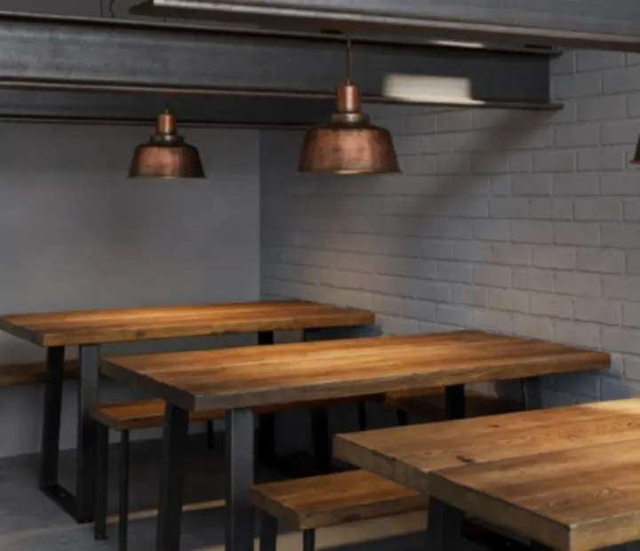 Industrial interior details at Urbanpont88 with exposed steel and warm terracotta lighting.